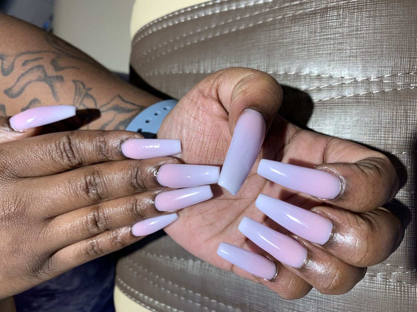 Long coffin nails with a baby pink to pale ombré finish