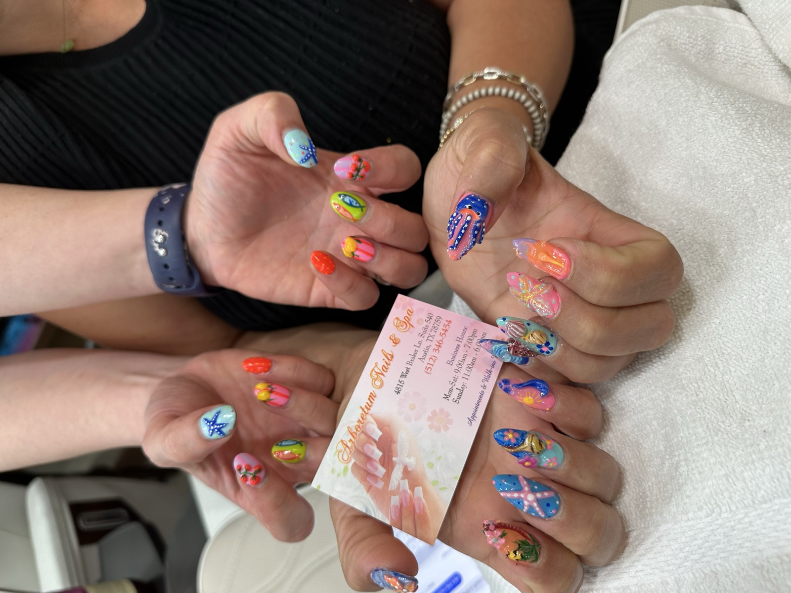 3D ocean-themed nail art with shells and starfish